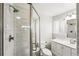 Modern bathroom with glass shower, tiled walls, and updated vanity provides a spa-like retreat at 7413 S Tamarac St, Centennial, CO 80112