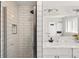 Modern bathroom with glass shower door, undermount sink, updated fixtures, and subway tile at 7413 S Tamarac St, Centennial, CO 80112
