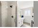 Updated bathroom boasts a glass shower enclosure, modern fixtures, and stylish subway tile at 7413 S Tamarac St, Centennial, CO 80112