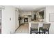 Modern kitchen has stainless steel appliances and breakfast bar at 7413 S Tamarac St, Centennial, CO 80112