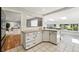 Bright kitchen with island and open floor plan offers seamless flow and plenty of natural light at 7413 S Tamarac St, Centennial, CO 80112