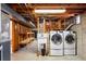 Unfinished laundry room with washer and dryer hookups, providing a functional space for laundry tasks at 7413 S Tamarac St, Centennial, CO 80112