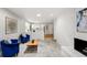 Bright living room with fireplace and view of the kitchen and dining area at 7413 S Tamarac St, Centennial, CO 80112