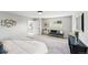 Spacious main bedroom with seating area, offers natural light and cozy space to relax at 7413 S Tamarac St, Centennial, CO 80112