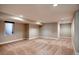 Spacious finished basement with neutral carpet, fresh paint, and recessed lighting at 3122 Perry St, Denver, CO 80212