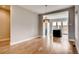 Dining room with hardwood floors, modern lighting, and open layout to the kitchen at 3122 Perry St, Denver, CO 80212