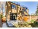 Modern exterior view with unique spiral staircase and fenced backyard at 3122 Perry St, Denver, CO 80212