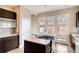 Modern kitchen with stainless steel appliances, sleek cabinetry, and ample counter space at 3122 Perry St, Denver, CO 80212