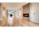 Spacious living room with hardwood floors, a modern fireplace, and natural light at 3122 Perry St, Denver, CO 80212