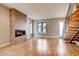 Bright and airy living room featuring a fireplace, hardwood floors, and modern architectural details at 3122 Perry St, Denver, CO 80212