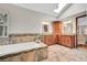 Bright bathroom features a skylight, soaking tub and double sink vanity at 3269 W 101St Cir, Westminster, CO 80031