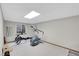 Basement workout area featuring modern treadmill and rowing machine by a window at 3269 W 101St Cir, Westminster, CO 80031