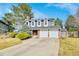 Charming two-story home with a well-manicured lawn, mature trees, and a two-car garage at 3269 W 101St Cir, Westminster, CO 80031