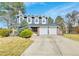 Charming two-story home with a well-manicured lawn, mature trees, and a two-car garage at 3269 W 101St Cir, Westminster, CO 80031