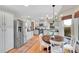 Spacious kitchen with stainless steel appliances, hardwood floors and a rustic dining set at 3269 W 101St Cir, Westminster, CO 80031