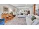 Open-concept living area featuring hardwood floors and seamless transition to the dining area at 3269 W 101St Cir, Westminster, CO 80031