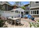 Backyard featuring a stone patio, outdoor dining area, and a covered lounge area on the deck at 758 N Franklin St, Denver, CO 80218