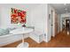 Bright breakfast nook featuring built-in bench seating, hardwood floors, and a colorful art piece at 758 N Franklin St, Denver, CO 80218