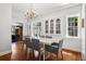 Charming dining room with a chandelier, built-in cabinets, and a view to other rooms at 758 N Franklin St, Denver, CO 80218