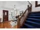 Elegant foyer with hardwood floors, a staircase, and a view into the living room, creating a welcoming entry at 758 N Franklin St, Denver, CO 80218