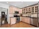 Charming kitchen with stainless steel appliances, granite countertops, and light wood cabinets at 758 N Franklin St, Denver, CO 80218