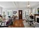 Charming living room featuring hardwood floors, a traditional wood door, and bright natural light at 758 N Franklin St, Denver, CO 80218