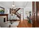 Open-concept living room features beautiful hardwood floors, staircase, fireplace, and bright natural light at 758 N Franklin St, Denver, CO 80218