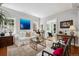 Hardwood floors and light paint brighten this living room featuring a sofa and decorative accents at 758 N Franklin St, Denver, CO 80218