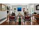 Well-lit living room features hardwood floors, a white couch, and decoratively adorned chairs at 758 N Franklin St, Denver, CO 80218