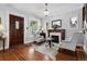 Comfortable living room showcasing a fireplace, hardwood floors, and a traditional wood door at 758 N Franklin St, Denver, CO 80218