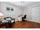 Office space featuring hardwood floors, a desk with a chair, and a window with curtains at 758 N Franklin St, Denver, CO 80218