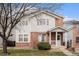 Charming two-story home featuring a combination of brick and siding and a cozy front porch at 10700 Kimblewyck Cir # 225, Northglenn, CO 80233