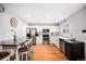 Bright kitchen with stainless steel appliances, bar seating and hardwood floors at 10700 Kimblewyck Cir # 225, Northglenn, CO 80233