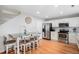 Bright kitchen with stainless steel appliances, bar seating and hardwood floors at 10700 Kimblewyck Cir # 225, Northglenn, CO 80233