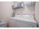 Laundry room with full sized washer and dryer at 10700 Kimblewyck Cir # 225, Northglenn, CO 80233