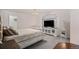 Main bedroom with neutral walls, walk in closet, and television at 10700 Kimblewyck Cir # 225, Northglenn, CO 80233