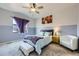 Comfortable bedroom features a bed, soft carpet, and a window with purple curtains for a cozy retreat at 6924 E 118Th Pl, Thornton, CO 80233