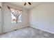 Simple bedroom with plush carpet, window and a closet at 6924 E 118Th Pl, Thornton, CO 80233