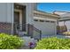 Inviting home entrance with a charming front porch and well-maintained landscaping at 6924 E 118Th Pl, Thornton, CO 80233
