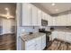 Beautiful kitchen with stainless steel appliances, ample cabinet space, and granite countertops at 6924 E 118Th Pl, Thornton, CO 80233