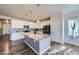 Modern kitchen with stainless appliances, an island and granite countertops at 6924 E 118Th Pl, Thornton, CO 80233