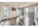 Bright living room with hardwood floors, lots of sunlight, and stylish curtains at 6924 E 118Th Pl, Thornton, CO 80233
