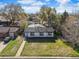 Aerial view of a single story home on a landscaped lot with a detached garage at 3025 Ivanhoe St, Denver, CO 80207