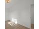 Empty hallway with natural light and wood flooring at 3025 Ivanhoe St, Denver, CO 80207