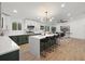 Stunning open kitchen with white countertops, a center island, and modern lighting at 3025 Ivanhoe St, Denver, CO 80207