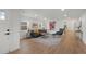 Bright living room with hardwood floors, a neutral color palette, and stylish modern furniture at 3025 Ivanhoe St, Denver, CO 80207