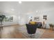 Inviting living room featuring hardwood floors, comfortable seating, and natural light at 3025 Ivanhoe St, Denver, CO 80207