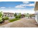 Spacious backyard with a concrete patio, green lawn, and landscaping at 3841 Colorful Ln, Castle Rock, CO 80109