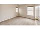 Bedroom with neutral walls, carpeted floors, and natural light from two windows at 3841 Colorful Ln, Castle Rock, CO 80109