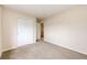 Clean bedroom featuring carpeted floors, neutral walls, and a closet with doors at 3841 Colorful Ln, Castle Rock, CO 80109